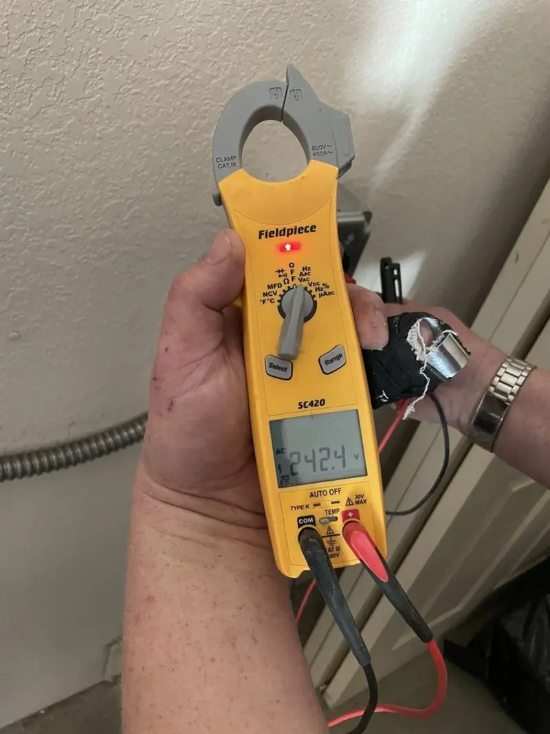 Voltage testing with clamp meter during Outlet Installation in Silver Hill